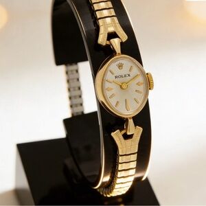 Rolex Women's Gold  Watch with Cream Dial and not original band.